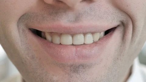 Close Up of Smiling Lips of Young Man Video stock 103789396