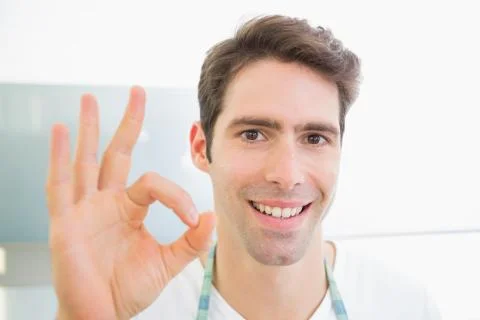 Close up of a smiling man gesturing okay sign Stock Photos