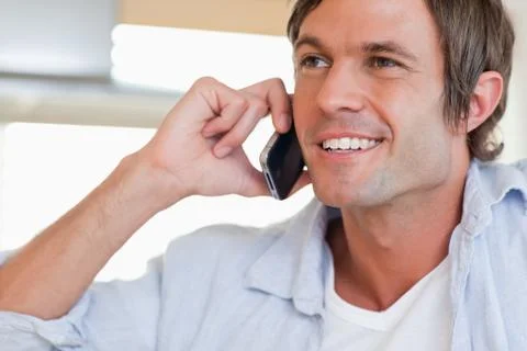 Close up of a smiling man making a phone call Stock Photos