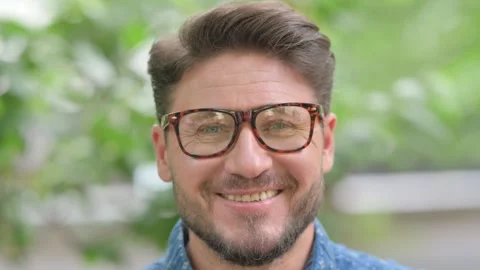 Close-up of a Smiling Middle Aged Man Face Видео 311379477