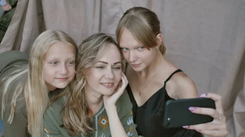 Close up of smiling mother with daughters makes funny selfies Stock Footage 161186681