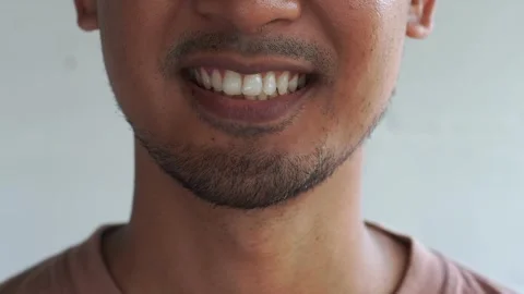 Close up of smiling teeth isolated. Detail of a smile bearded man. Stock Footage 327206219