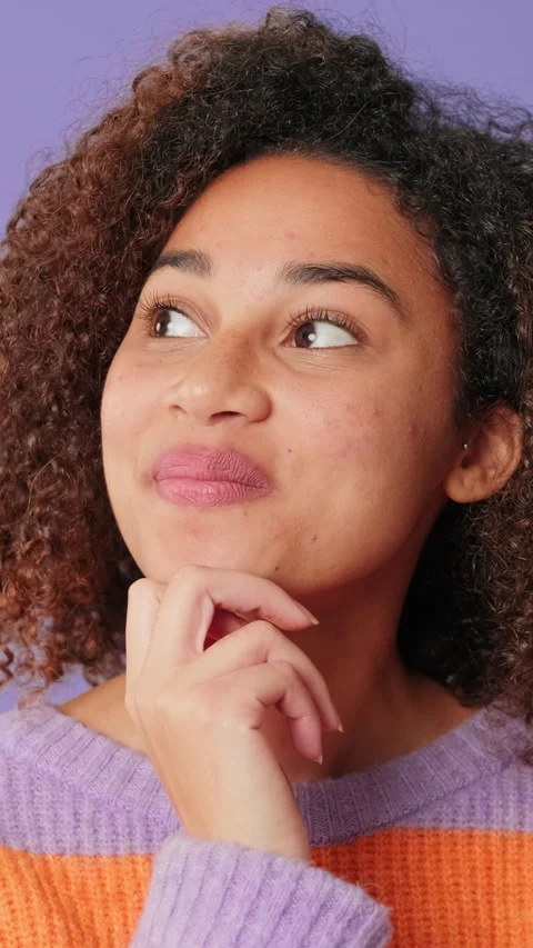 Close-up of smiling woman choosing, making decision looking at camera on lilac Stock Footage 301457327