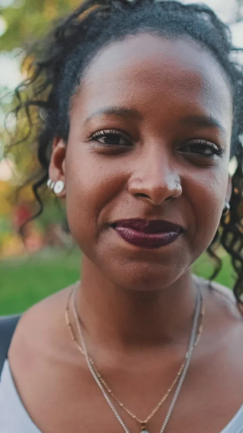 Close up, smiling young mixed race woman looking at camera Stock Footage 226921964