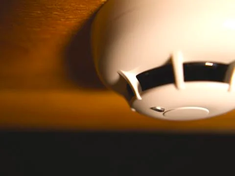 Close up smoke detector on the ceiling Stock Photos