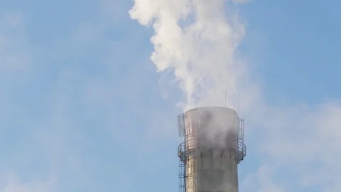 Close up smoke stack over blue sky background. Stock Footage 85382992