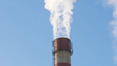 Close up smoke stack over blue sky background. Stock Footage 85383338
