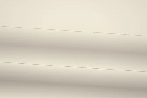 Close-up of smooth beige fabric with subtle folds Stock Photos