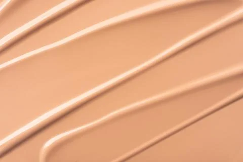 Close-up of smooth beige foundation texture with natural curves and details,  Stock Photos
