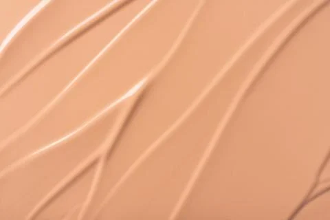 Close-up of smooth beige foundation texture with natural curves and details,  Stock Photos