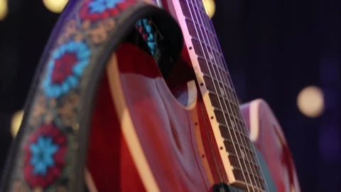 Close-up of the smooth drive from the fretboard to the deck of the red vintage Stock Footage 200795753