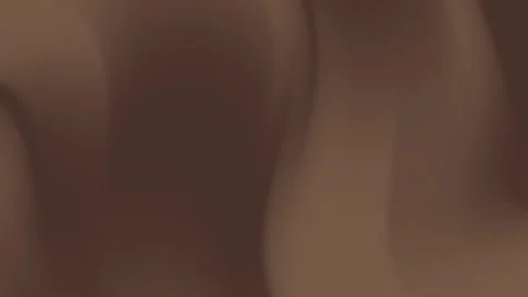 Close-up of smooth flowing chocolate waves with rich brown hues Stock Footage 315268205