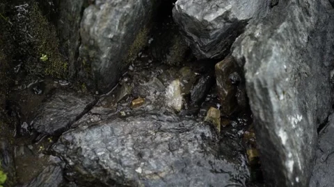 Close up of a smooth flowing water over rocks in the Mountains. Stock Footage 145122113
