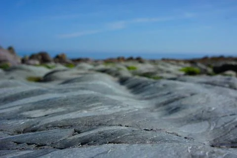 Close Up of Smooth Grey Rolling Rocks Stock Photos