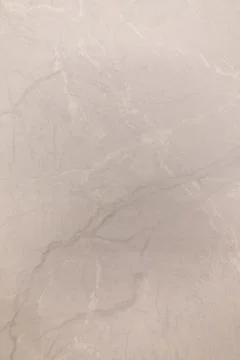 Close-up of smooth light gray marble surface with subtle patterns seen in indoor 스톡 사진