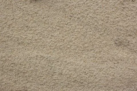 Close-up of smooth sand at a beach texture background. Full frame shot of sand Stock Photos