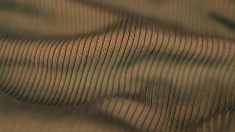 Close-up of the Smooth Silk Texture of the Brown Gold Clothing Fabric. Textile I Video stock 136111356