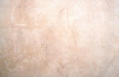 Close-up of a smooth stone surface with a fine marble pattern. Stock Photos