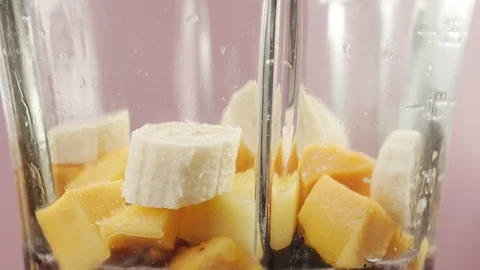 Close-up of smoothie preparation in blender with fresh fruits and berries Stock Footage 125067881