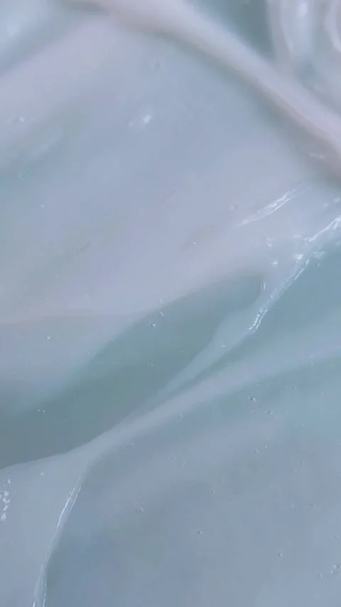 Close up of smoothing wavy soft white cream. Beauty product cream being sti.. Stock Footage 339305205
