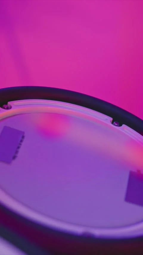 Close up of snare drum being played with pink and purple soft lighting with Stock Footage 345986079