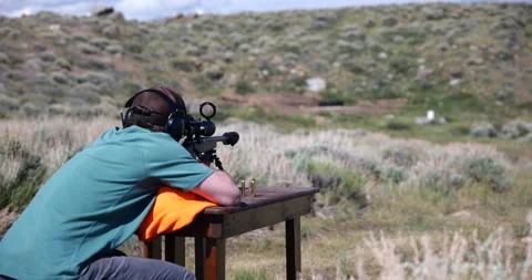 Close-up of a sniper rifle being fired during a military training exercise Stock Footage 341428009
