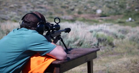 Close-up of a sniper rifle being fired during a military training exercise Stock Footage 341466077