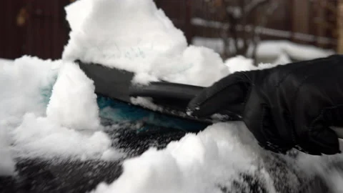 A close-up of a snow brush clears off snow. Winter in Russia, the car was Stock Footage 145770421