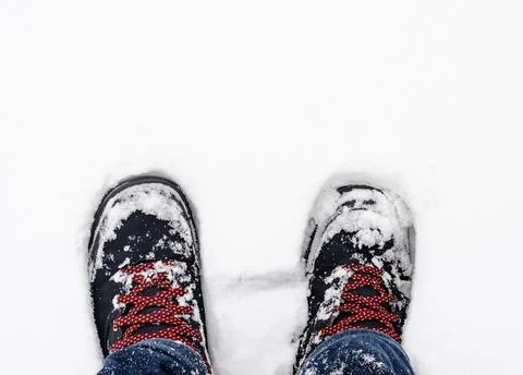 Close-up of  snow-covered boots  durring  winter Stock Photos