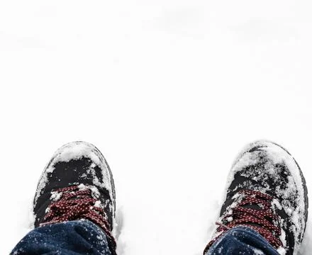 Close-up of  snow-covered boots  durring  winter Stock Photos