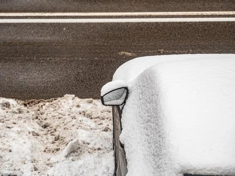 Close up of snow covered car side mirror in winter Fotos de archivo
