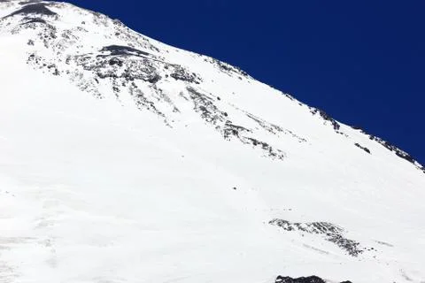 Close-up of the snow-covered eastern peak of Mount Elbrus in the North Caucas Stock Photos
