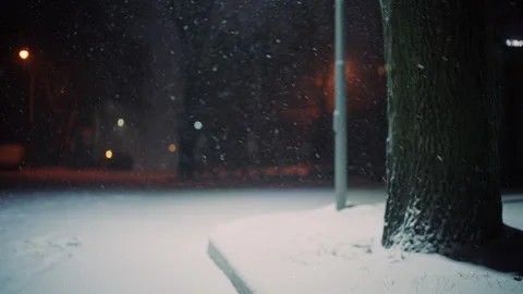 Close up of snow covered ground with shallow depth of field as snowflakes fall Stock-Footage 329391671