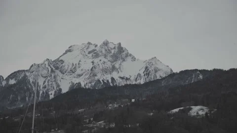 Close-Up Of Snow-Covered Mount Pilatus With A Bird Flying By Stock Footage 147130109