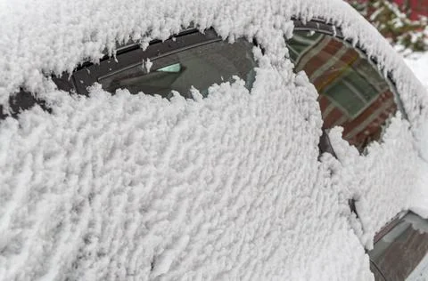 Close-up of snow-covered side Windows of a car Stock Photos