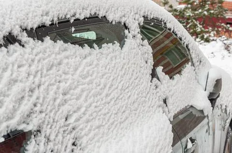 Close-up of snow-covered side Windows of a car Foto stock