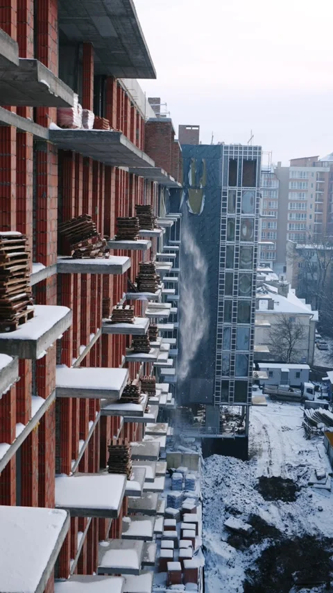 Close-up of snow falling from the edge of a rooftop Stock Footage 327842505