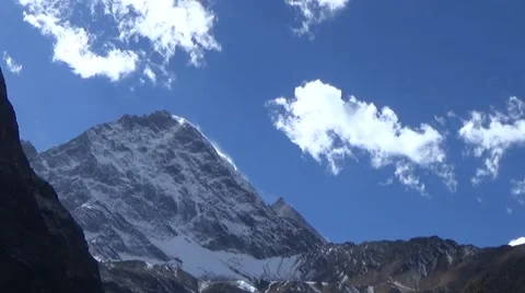 Close up of snow mountain summit and fast moving clouds Stock Footage 43220582