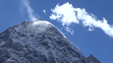 Close up of snow mountain summit and fast moving clouds Stock Footage 43220723