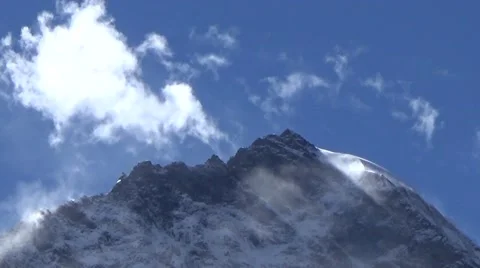 Close up of snow mountain summit and fast moving clouds Stock Footage 43220769
