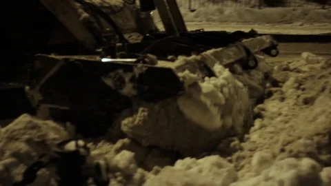 Close-up of snow removal equipment while working at night on the street Stock-Footage 107650858