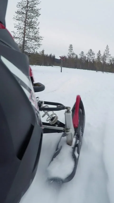 CLOSE UP: Snow spraying from underneath the snowmobile skies on ride in nature Stock Footage 301986210
