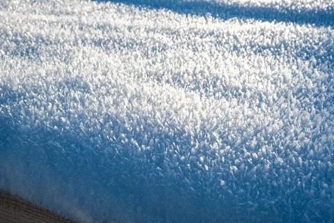 Close-up snowflakes texture. Winter background. Small depth of field. White Stock Photos