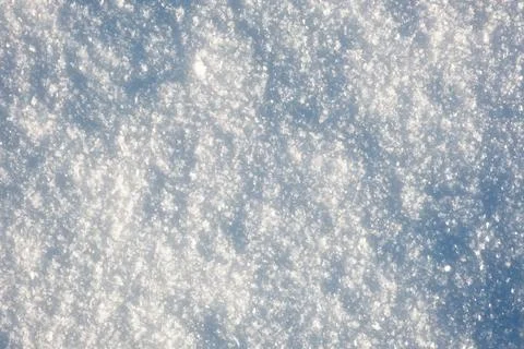 Close-up snowflakes texture. Winter background. Small depth of field. White Stock Photos