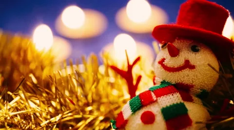 Close up of a Snowman on candles background Stock Footage 44464516