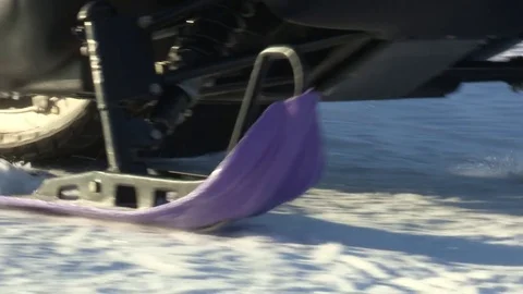 Close up of a snowmobile passing by Stock Footage 74690190