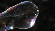 Close-Up Soap Bubble Expanding And Bursting In Ultra-Slow Motion Stock Footage