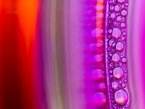 Close up soap bubble on water led light background Stock Photos