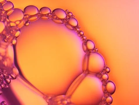 Close up soap bubble on water led light background Stock Photos