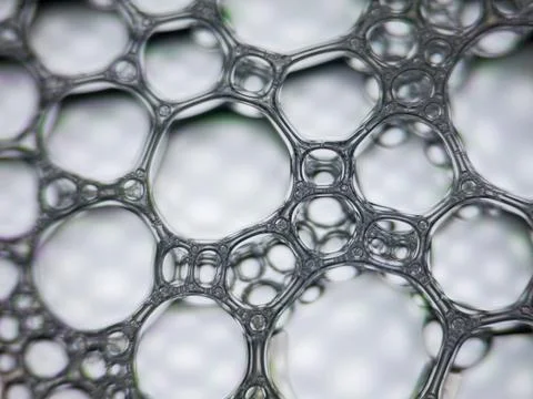 Close up of soap bubbles forming abstract pattern background Stock Photos